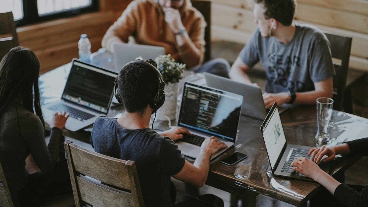 Business leaders comparing software build versus buy options